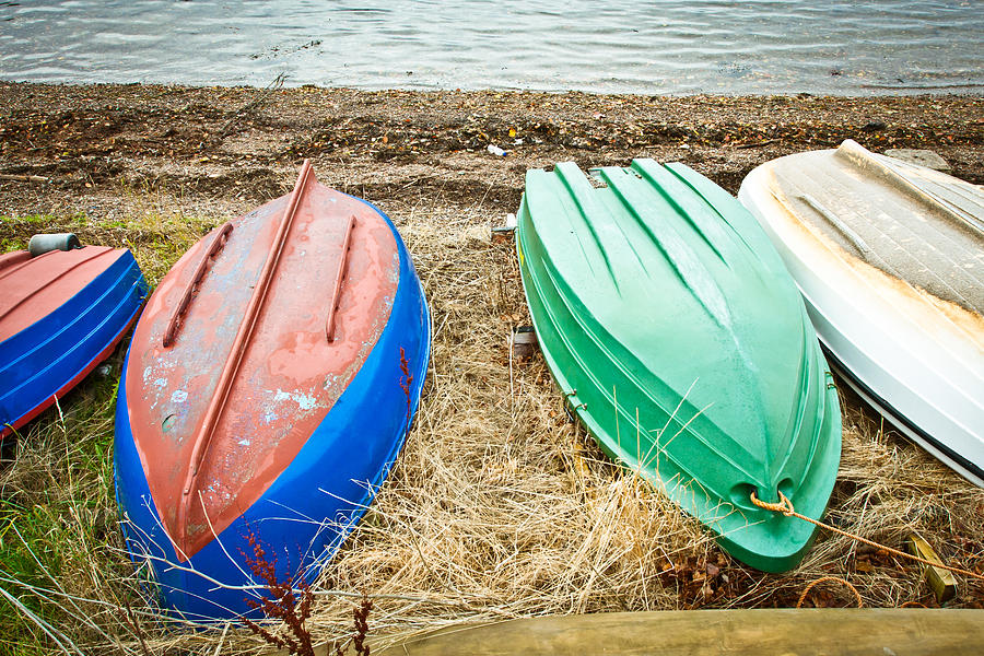 Upturned boats Photograph by Tom Gowanlock
