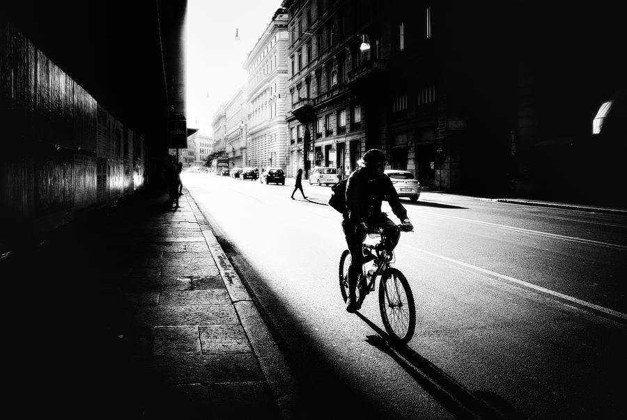 Street Photograph - Urban Cyclist by Massimiliano Mancini