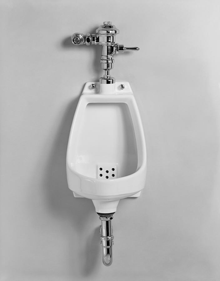 Urinal on white background, close-up, Photograph by Tom Kelley Archive