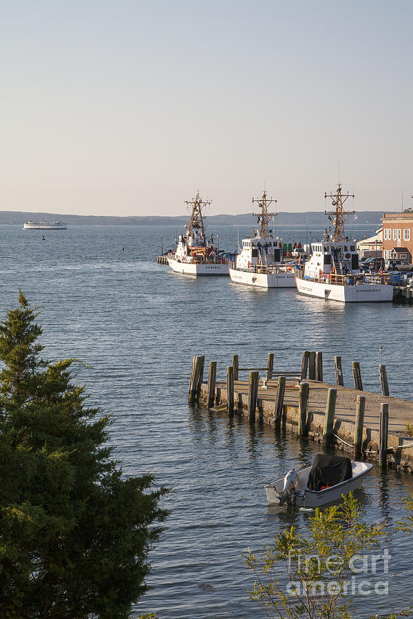 US Coast Guard cutters in a harbor at Woods Hole on Cape Cod Massachusetts. Photograph by William Kuta
