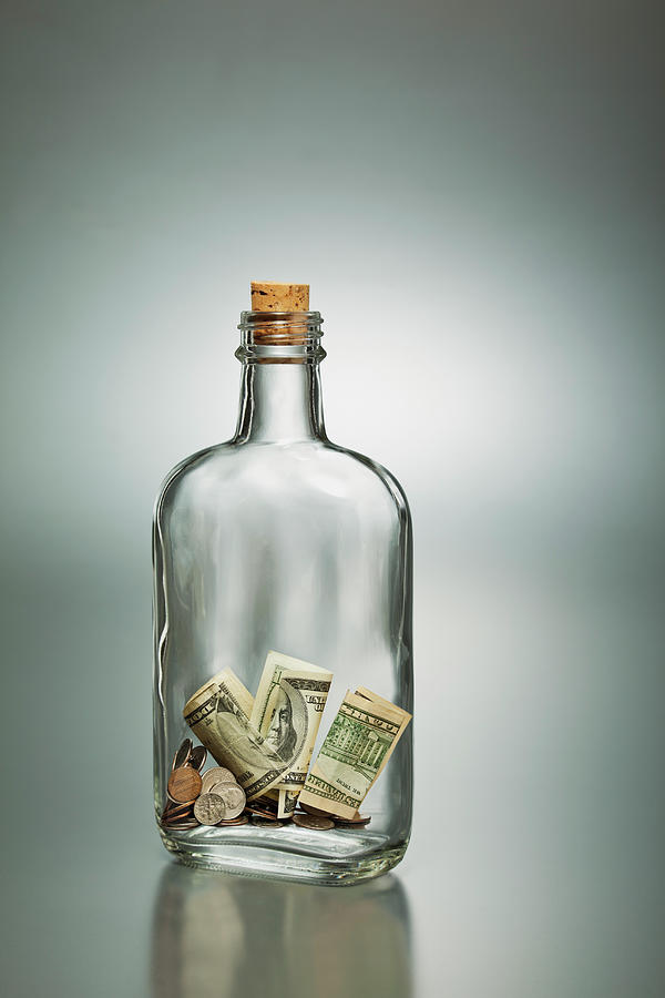 Us Dollar Banknotes In A Bottle Photograph by Yuji Sakai