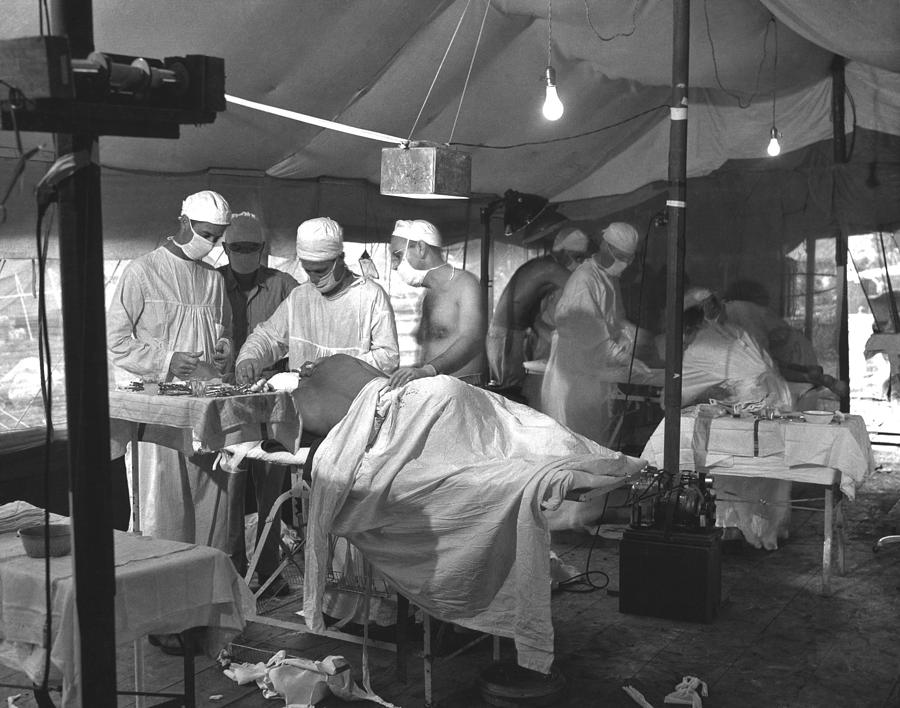 U.s. Navy Doctors And Corpsmen Operate Photograph by Everett