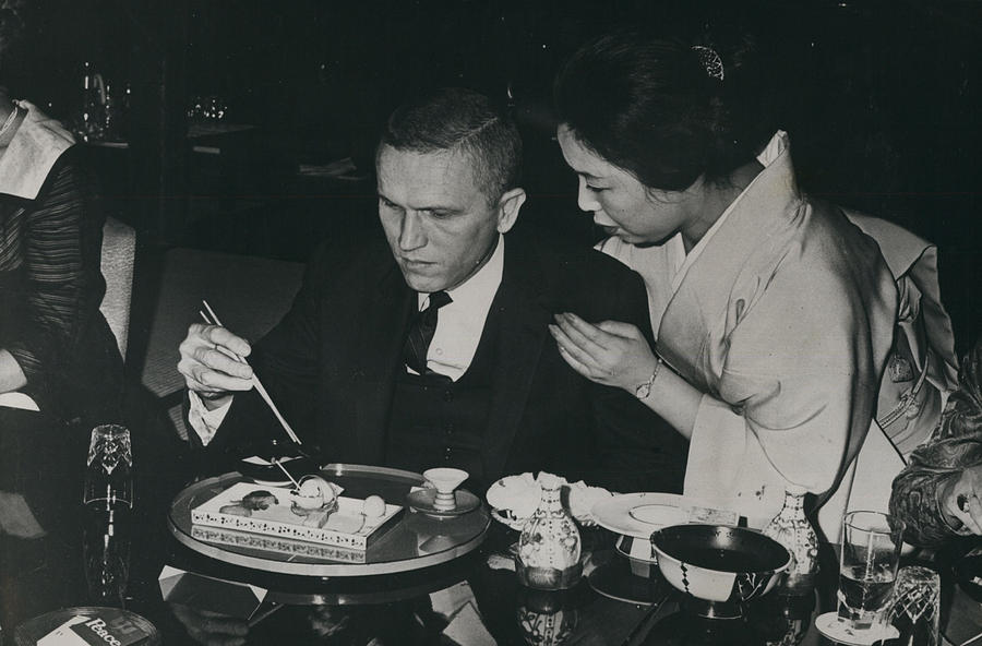 U.s. Spaceman Gets Chopstick Lesson Photograph by Retro Images Archive