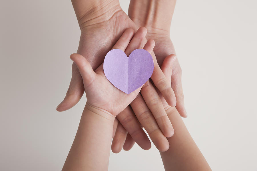 USA, Illinois, Metamora, Hands of mother and daughter (4-5) holding paper heart Photograph by Vstock LLC