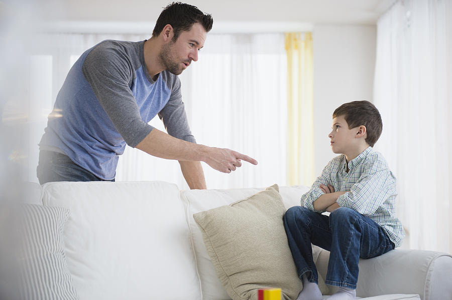 USA, New Jersey, Jersey City, Father disciplining son (8-9) Photograph by Jamie Grill