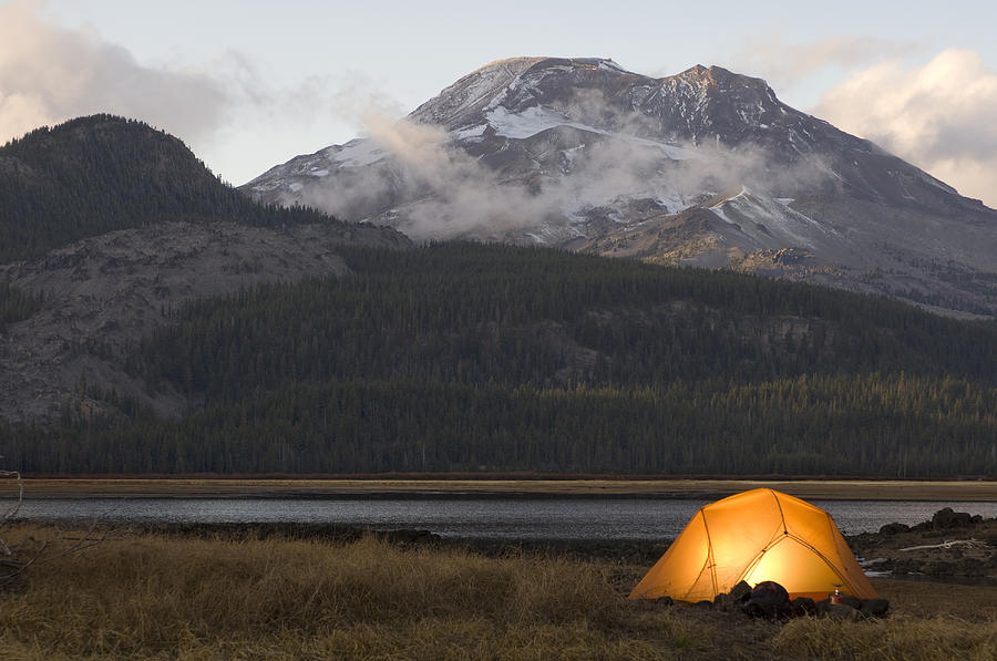 USA, Oregon, Bend, illuminated tent by lake in mountains Photograph by Chase Jarvis
