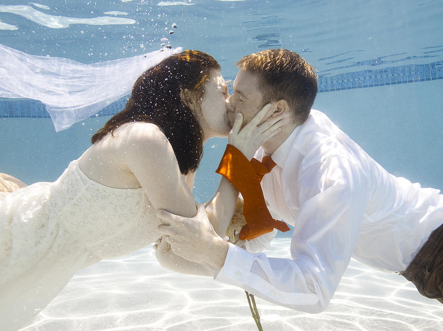 USA, Utah, Orem, Wedding couple under water Photograph by Nicole Hill Gerulat