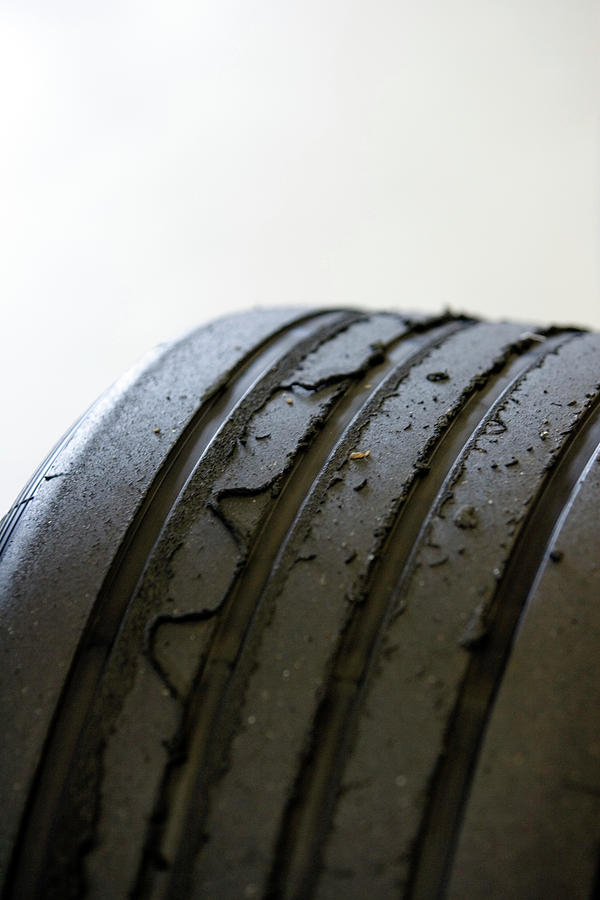 Used Formula One Car Tyres Photograph by Gustoimages/science Photo Library