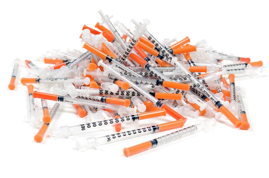 Still Life Photograph - Used Insulin Syringes by Daniel Sambraus/science Photo Library
