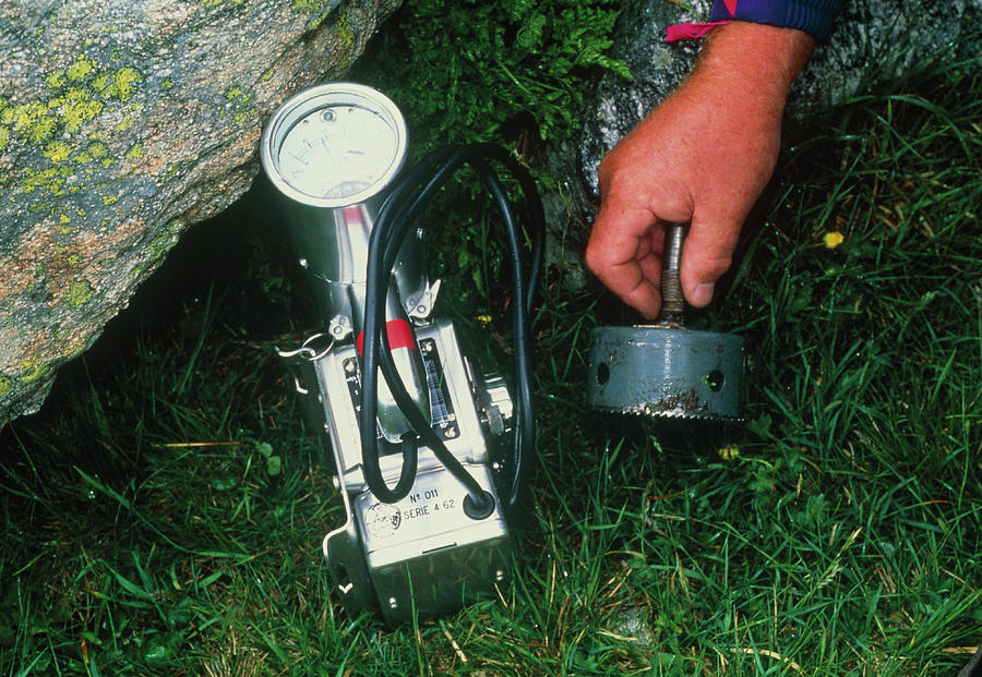 Using A Geiger Counter To Measure Radiation Levels Photograph by Pascal ...