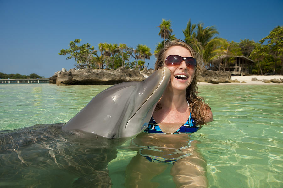 Vacation Lifestyles-Dolphin Kissing Womans Cheek Photograph by Avid_creative