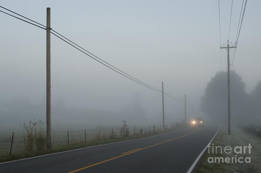 Valley fog with truck lights on back road Photograph by Jim Corwin