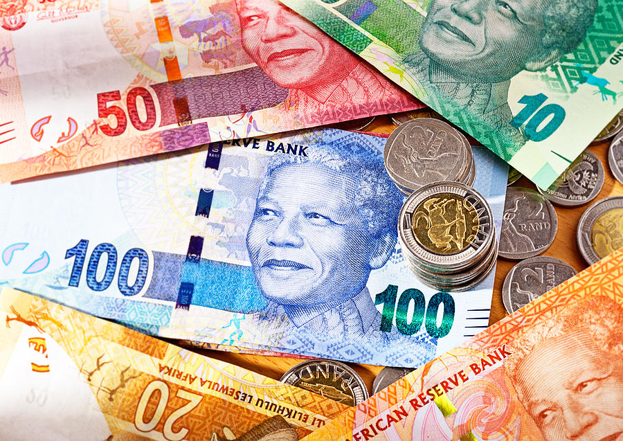 Varied new South African Mandela banknotes with coins Photograph by RapidEye