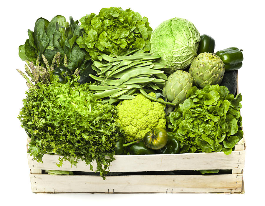 Variety of green vegetables sitting in a wooden box Photograph by Aluxum