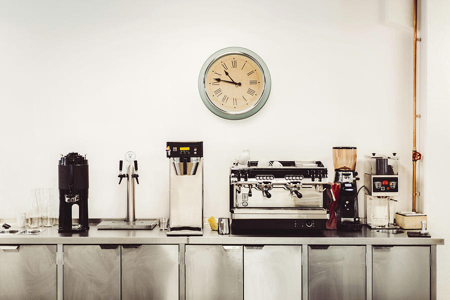 Various coffee makers on commercial kitchen counter Photograph by Maskot