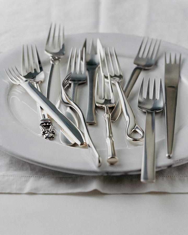 Various Forks On A Plate Photograph by Romulo Yanes