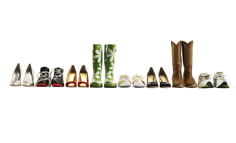 Various shoes in a row, studio shot Photograph by Thomas Northcut