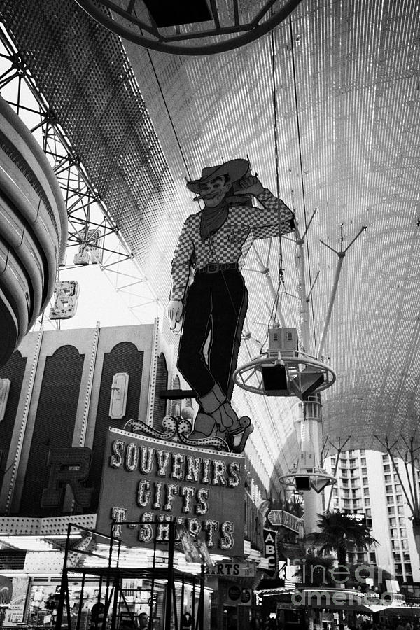Las Vegas Photograph - vegas vic cowboy sign at the freemont street experience during the day Las Vegas Nevada USA by Joe Fox