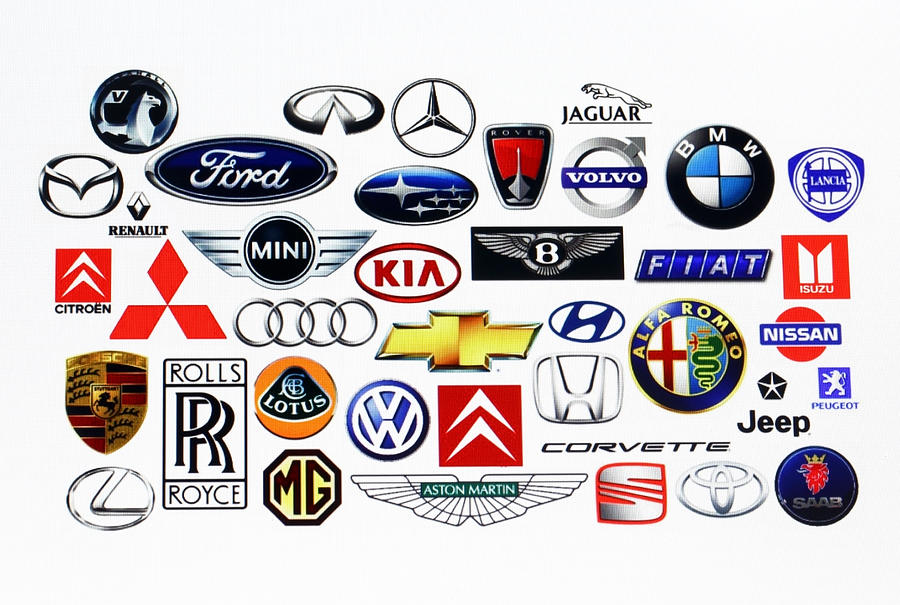 Vehicle manufacturer logos Photograph by Mattjeacock