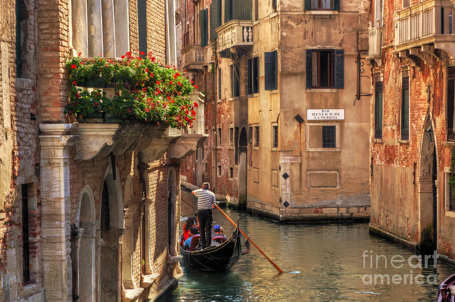 Venice Italy Gondola floats on a canal among old Venetian architecture Photograph by Michal Bednarek
