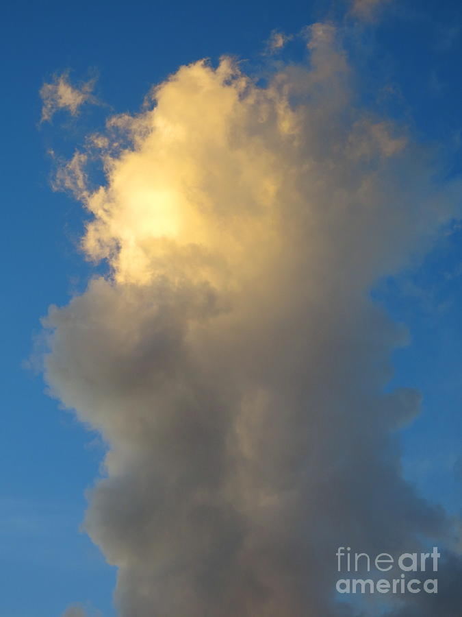 Vertical Cloud with Sun Highlighting it. Photograph by Robert Birkenes