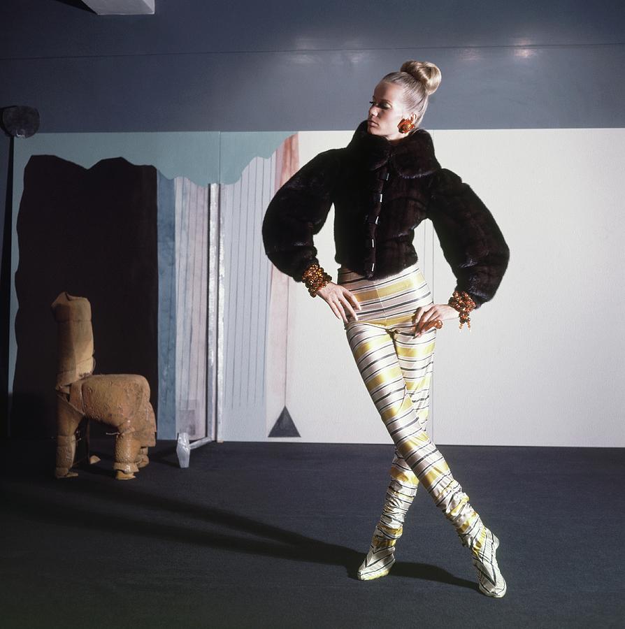 Veruschka Wearing Fur Jacket And Striped Tights Photograph by Horst P. Horst
