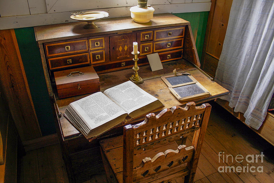 Very old desk with vintage open bible Photograph by Patricia Hofmeester