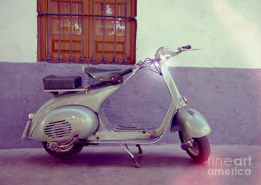 Vespa Piaggio classic scooter parked in a spanish street Photograph by Perry Van Munster