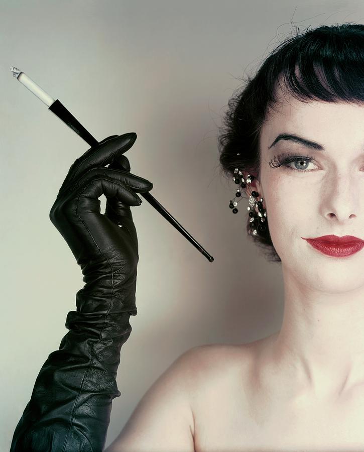 Victoria Von Hagen Holding A Cigarette Holder Photograph by Erwin Blumenfeld