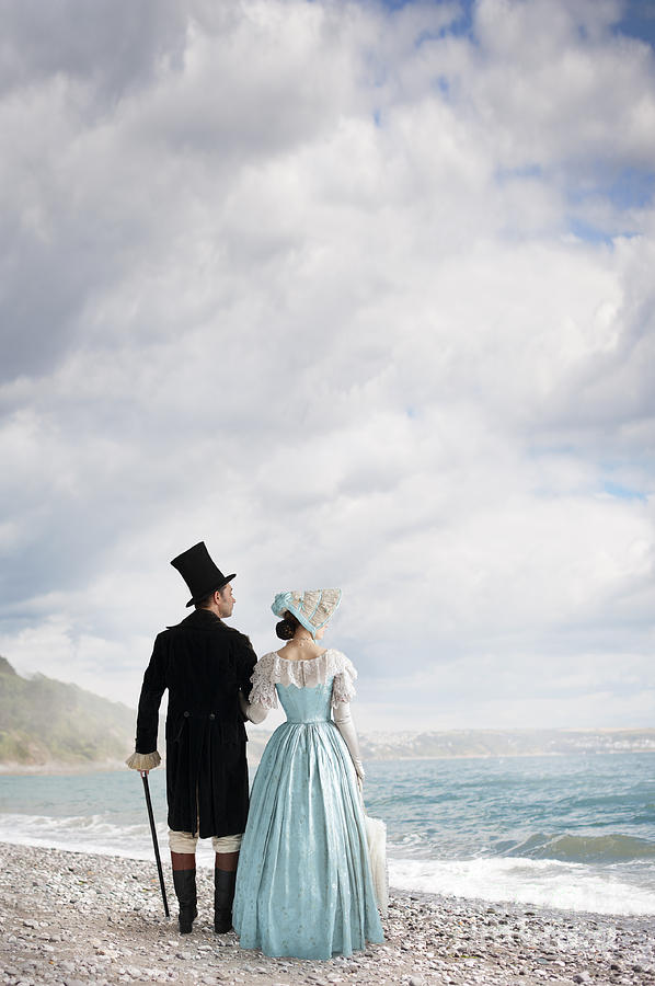 Victorian Couple On A Beach Looking Out To Sea Photograph by Lee Avison