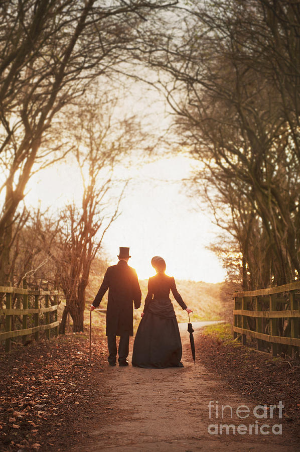 Sunset Photograph - Victorian Couple Taking A Walk At Sunset by Lee Avison