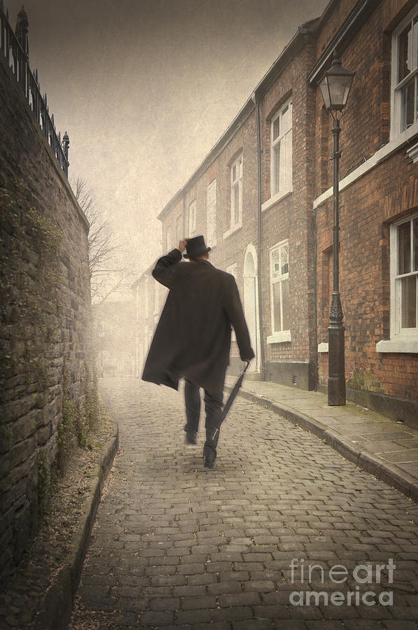 Victorian Man Running On A Cobbled Road Photograph by Lee Avison