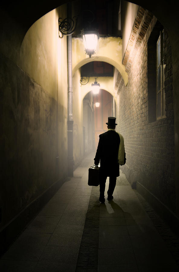 Architecture Photograph - Victorian man with top hat carrying a suitcase in the alley by Jaroslaw Blaminsky
