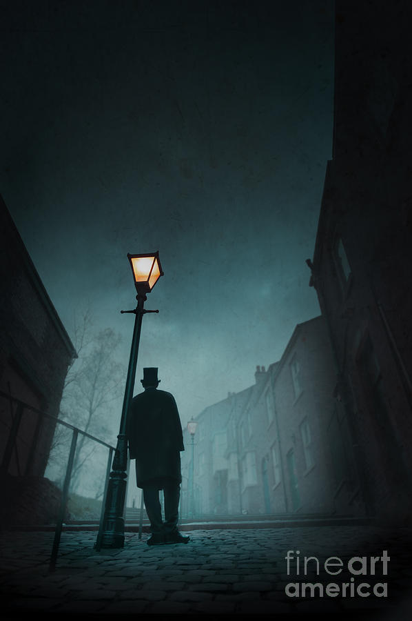 Winter Photograph - Victorian Man With Top Hat Leaning On A Street Light by Lee Avison