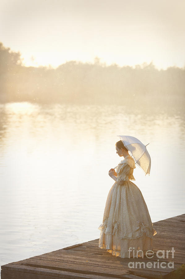 Sunset Photograph - Victorian Woman On A Lake Jetty At Sunset by Lee Avison
