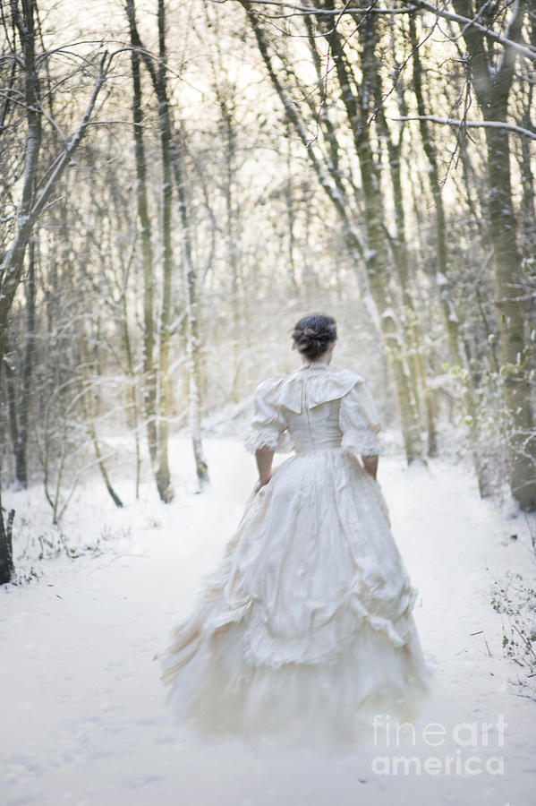Winter Photograph - Victorian Woman Running Through A Winter Woodland With Fallen Sn by Lee Avison
