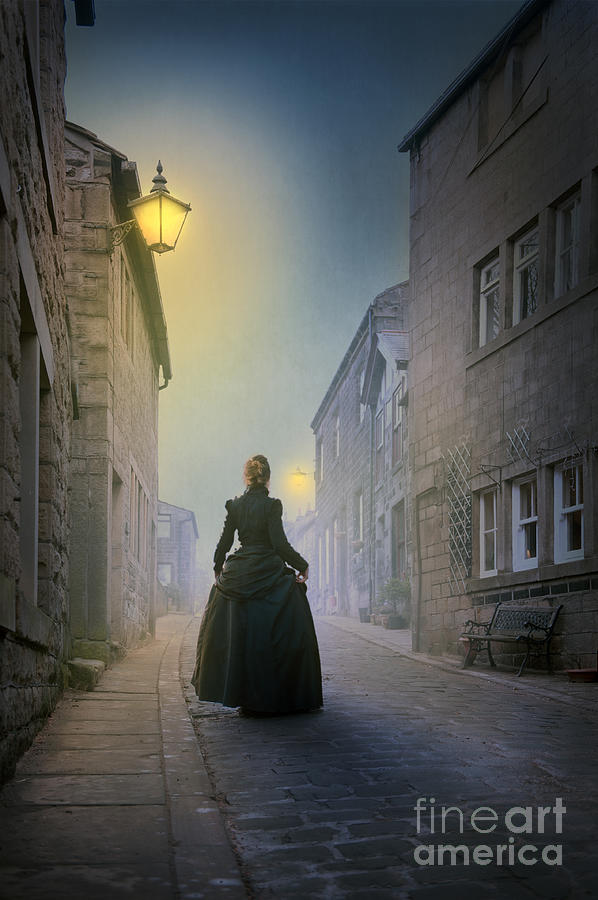 Victorian Woman Walking Up A Cobbled Street Photograph by Lee Avison