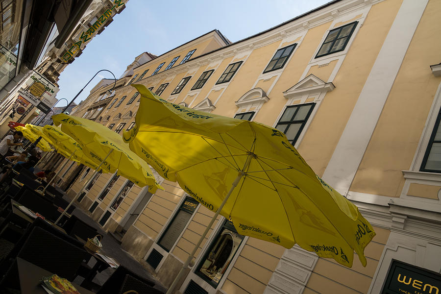 Vienna Street Life - Cheery Yellow Umbrellas At An Outdoor Cafe Photograph
