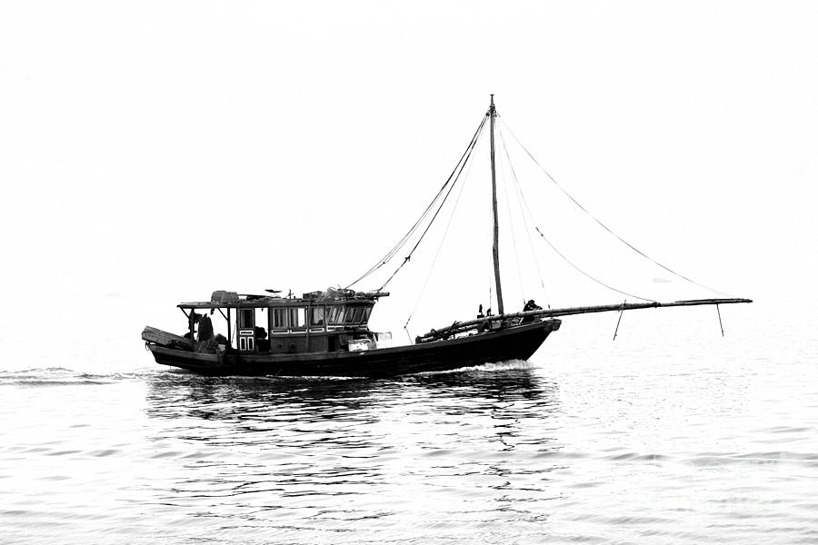 Vietnam boat fish by Chuck Kuhn