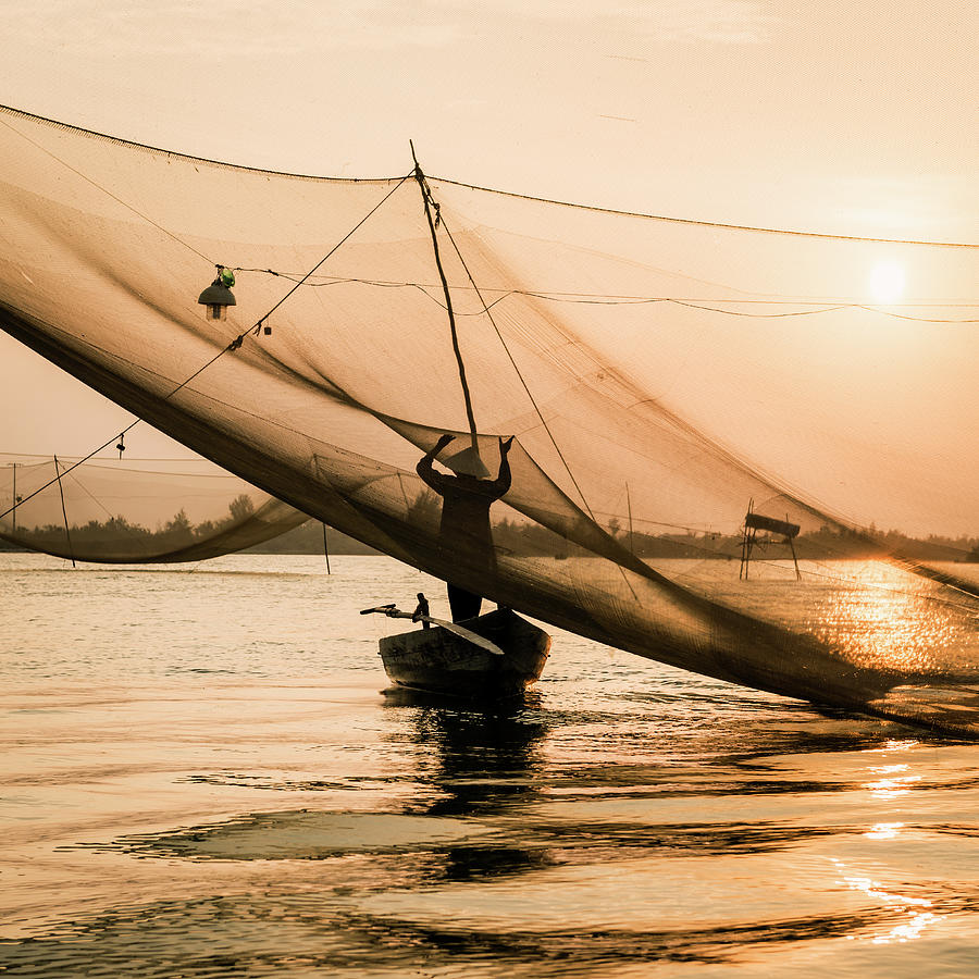 Vietnam, Traditinal Fisherman Tending Photograph by Martin Puddy