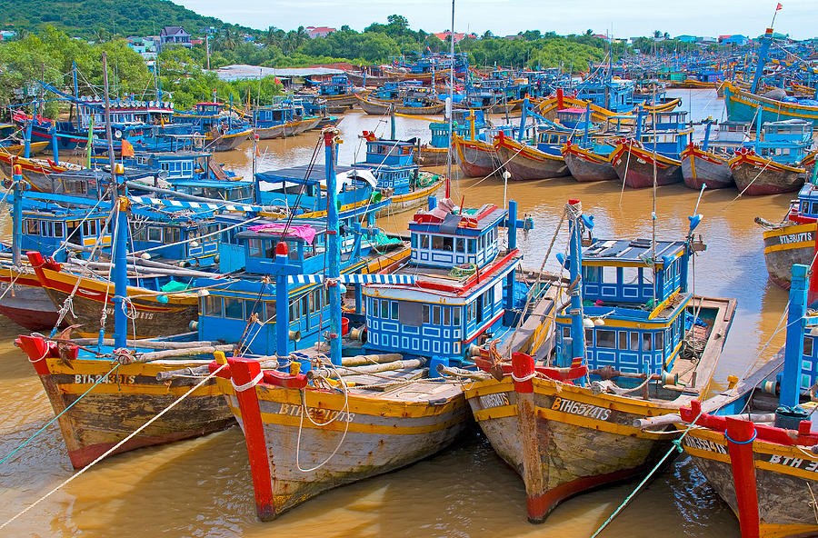 Vietnamese fishing boats Photograph by Dennis Cox