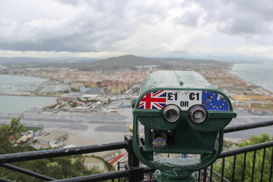 View from Rock of Gibraltar towards Spain with storm clouds and a telescope showing UK and the EU, Gibraltar Photograph by Thomas Janisch