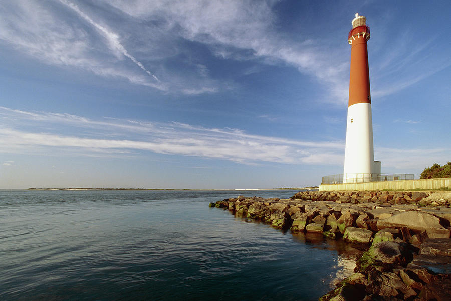 Architecture Photograph - View of a Red and White Lighthouse by George Oze