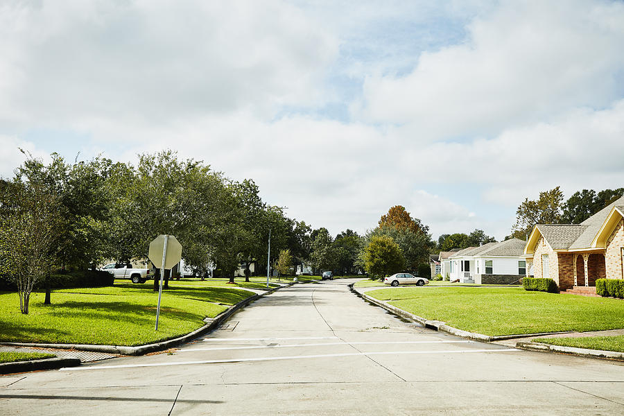 View of street in residential neighborhood on sunny afternoon Photograph by Thomas Barwick