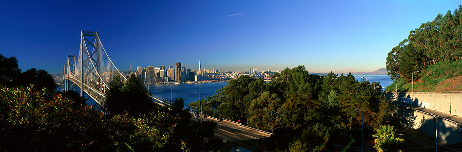 San Francisco Photograph - View Of The Bay Bridge And Downtown San by Panoramic Images