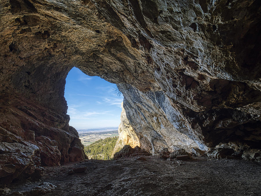 View of the forest and mountains landscape from  the cave inside in the Nature reserve of the saw Mariola. Photograph by Jose A. Bernat Bacete