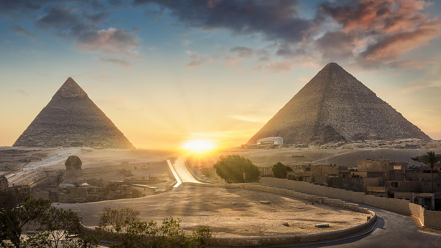 View of The Great Sphinx, Pyramid of Khafre and Great Pyramid of Giza at sunset, Cairo, Giza, Egypt Photograph by Harald Nachtmann