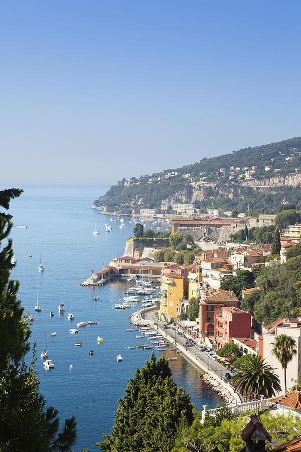 Villefranche-sur-Mer filled with boats off the shoreline Photograph by Sjoeman