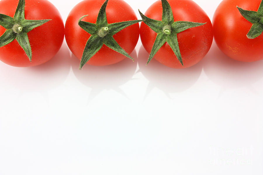 Vine tomatoes on top edge copy space Photograph by Simon Bratt