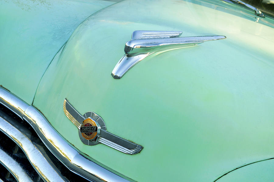 Vintage American Green Chrysler Car With Hood Ornament And Emblem Photograph